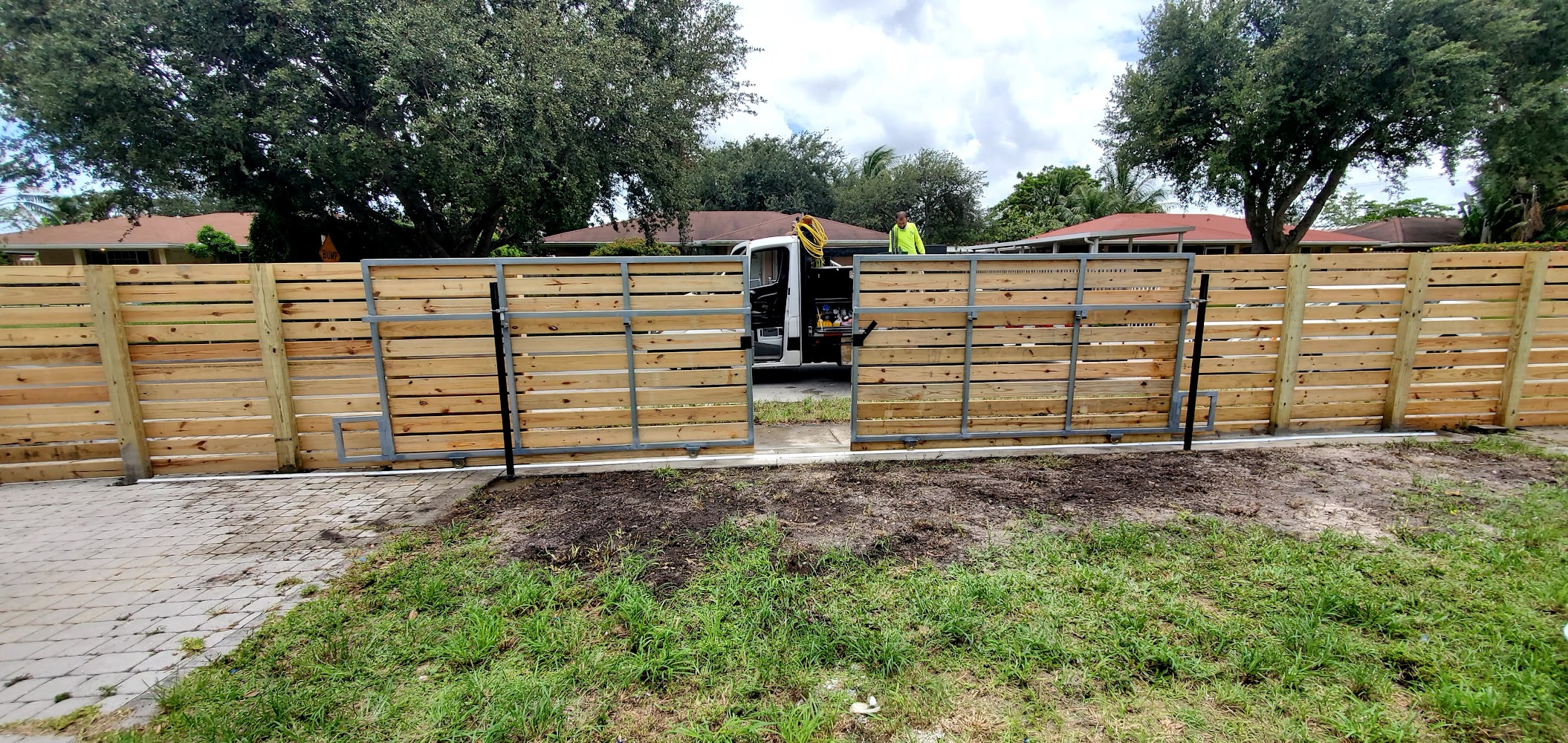 Wood fence supplies banner — The Link Store, Oakland Park, Florida