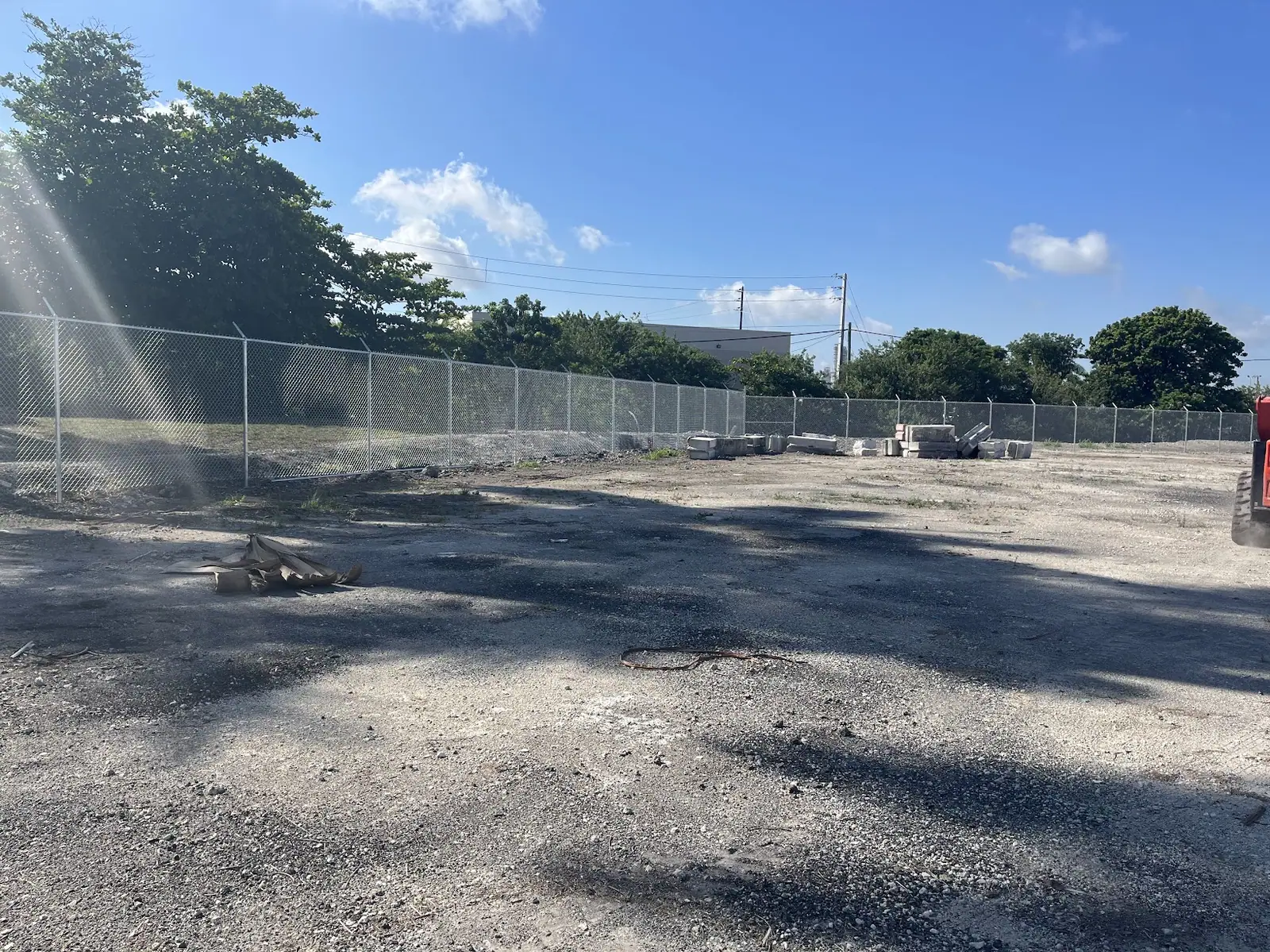 Long chain link fence run protecting a Broward County property