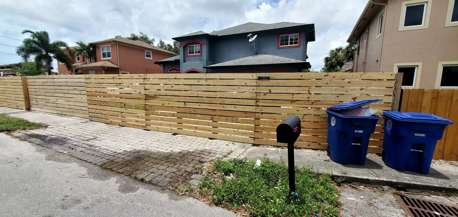 Long wooden privacy fence run in a Broward County neighborhood